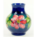 A MOORCROFT CLEMATIS VASE DESIGNED BY WALTER MOORCROFT, IMPRESSED MARKS, BLUE PAINTED INITIALS