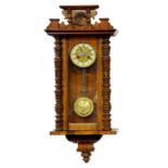 A WALNUT 'VIENNA' CLOCK WITH GRIDIRON PENDULUM