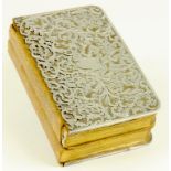 A SILVER MOUNTED LEATHER BOUND PRAYER BOOK AND HYMNAL, WITH FOLIATE PIERCED COVERS, CIRCA 1900