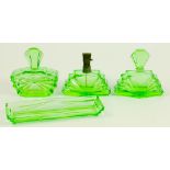 AN ART DECO GREEN GLASS DRESSING TABLE SET, INCLUDING A SCENT BOTTLE WITH ATOMISER, CIRCA 1930