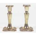 A PAIR OF EDWARD VII SILVER DWARF CANDLESTICKS WITH NOZZLES, BIRMINGHAM 1902, LOADED