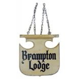 A PAINTED WOOD SHIELD SHAPED HANGING SIGN INSCRIBED BRAMPTON LODGE