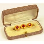 A VICTORIAN RUBY AND GOLD BAR BROOCH OF TRIPLE 'TARGET' DESIGN, ADAPTED, 3.1G GROSS