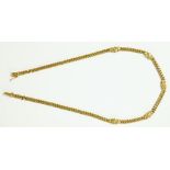 A GOLD FLAT CURB NECKLACE SET WITH DIAMONDS AT INTERVALS, MARKED 750, 28.5G GROSS