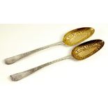 A PAIR OF GEORGE III SILVER TABLE SPOONS, LATER CHASED AND GILT AS 'BERRY' SPOONS, BY HESTER