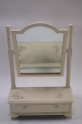 A chalk painted dressing table mirror