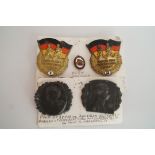 Two East German badges and two others