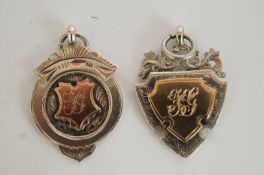 Two silver football medals