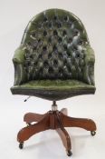 A green leather standard desk chair