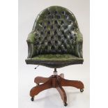 A green leather standard desk chair