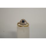 A sapphire and diamond 18ct gold cluster