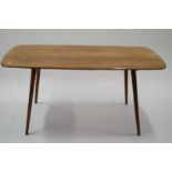 An Ercol dining table and four matching