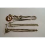 Three metal watch chains