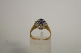 A sapphire and diamond 9ct gold cluster