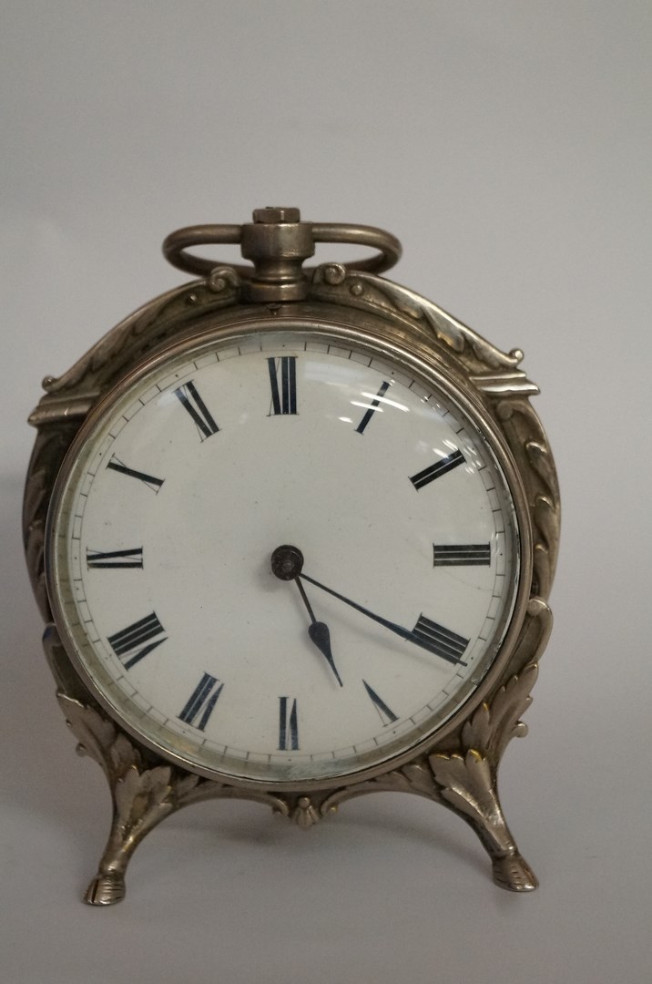 A silver plated drum clock