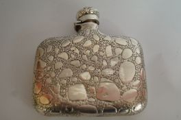 A silver hip flask
