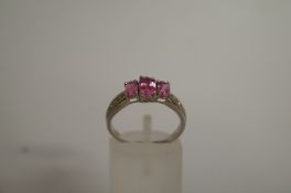 A 9ct gold pink topaz and diamond ring