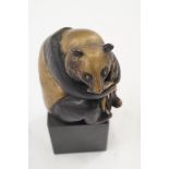 A bronze model of a panda