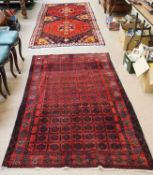 A Torkaman in rug in red and dark blue,