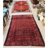 A Torkaman in rug in red and dark blue,