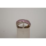 A diamond and pink sapphire dress ring,