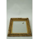 A decorative gilt frame mirror