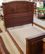 An early 20th century French walnut bed