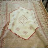 A large decorative carpet and one other