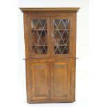 A large oak corner cupboard