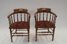 A pair of walnut tub chairs