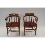 A pair of walnut tub chairs