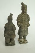 A pair of oriental terracotta figures