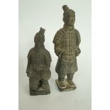 A pair of oriental terracotta figures