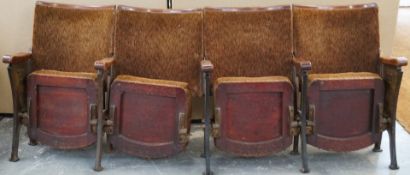 A set of four 1950's cinema chairs, each