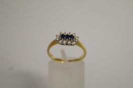 A sapphire and diamond 18ct gold cluster
