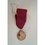 A replica George medal