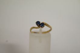 A 9ct gold sapphire twist ring