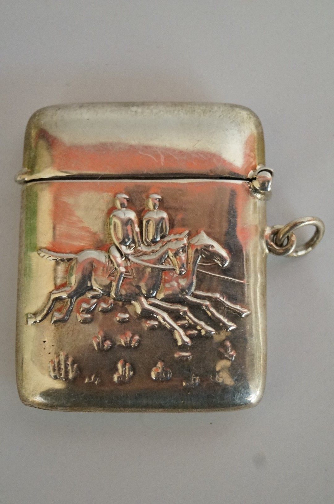 A silver vesta case with hunting scene s