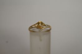 A single stone citrine ring, with two si