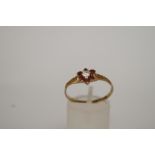 A garnet and cubic zirconia 9ct gold clu