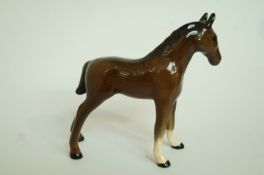 A small Beswick brown horse, standing