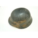 A WWI German helmet, along with a WWII G