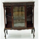 A carved 20th century display cabinet