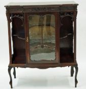 A carved 20th century display cabinet
