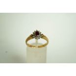 A ruby and diamond 9 carat gold cluster