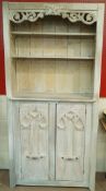 A large painted pine cupboard