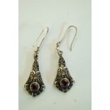 A pair of drop earrings, set with a sing