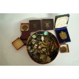 A collection of various military badges,