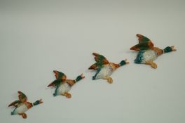 A set of four Beswick ducks