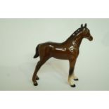 A Beswick brown foal, standing